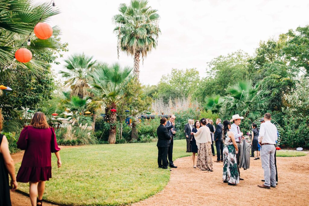 Guests wait for a wedding ceremony to begin at Ivy Hall Events in San Antonio, TX