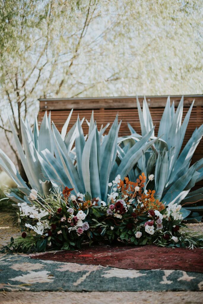 A beautiful floral arrangement in front of the agave at Ivy Hall Events