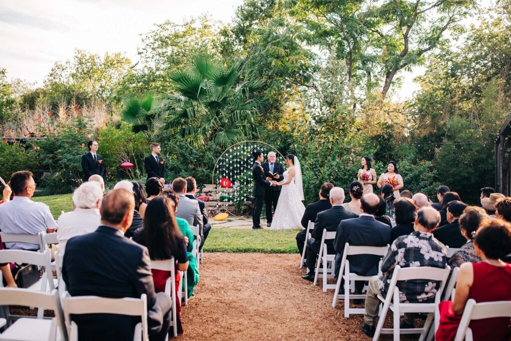 A wedding ceremony takes place in San Antonio, TX at Ivy Hall Events