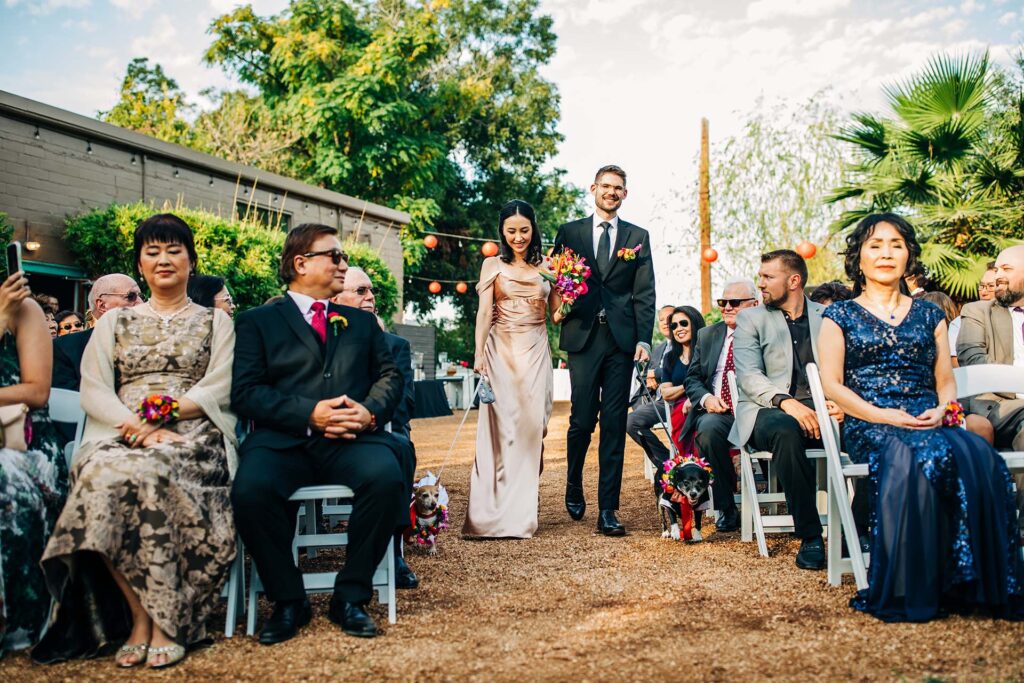 An outdoor wedding procession at Ivy Hall Events in San Antonio, TX
